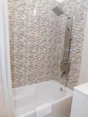 a bathroom with a toilet and a shower and a sink at Estrela Mar Marina Villa in Quarteira