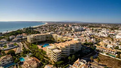 an aerial view of a city and the ocean at VR Galé Mar in Albufeira