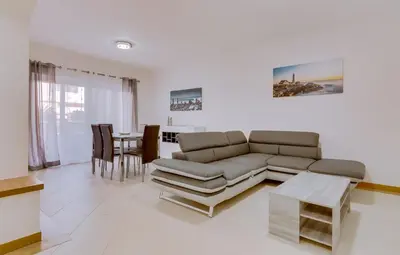 a living room with a couch and a table at Victoria Boulevard - Vasco da Gama - Vilamoura in Vilamoura