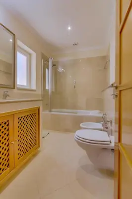 a bathroom with a toilet and a sink and a tub at Victoria Boulevard - Vasco da Gama - Vilamoura in Vilamoura