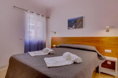 a bedroom with two towels on a bed at Victoria Boulevard - Vasco da Gama - Vilamoura in Vilamoura