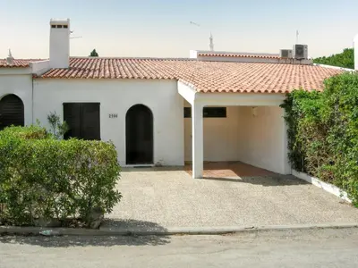 a white house with a red roof at Welcoming House in Albufeira in Albufeira