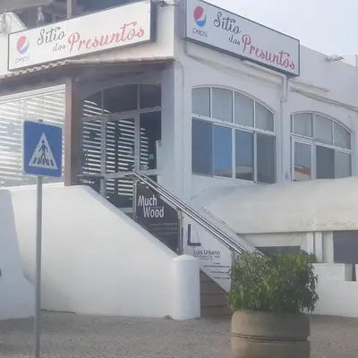 a building with a sign in front of it at Eucalipto in Faro