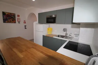 a kitchen with a sink and a counter top at Apartamento T0 Albufeira perto do Centro in Albufeira