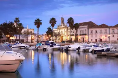 a group of boats docked in a marina at night at Casa Mimi in Faro
