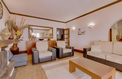 a living room with a couch and chairs and a table at Vila Caracas - V3 - Vilamoura in Vilamoura
