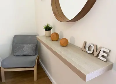 a mirror and a chair on a shelf with a love sign at Sunset Bacara - Near Vilamoura Marina in Vilamoura