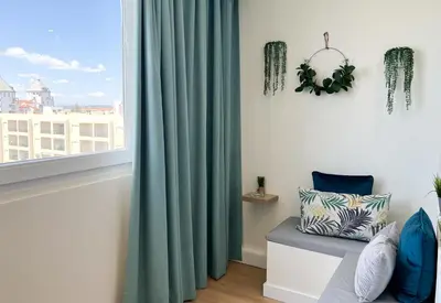 a room with a window with a green curtain at Sunset Bacara - Near Vilamoura Marina in Vilamoura