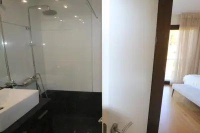 a bathroom with a shower and a white sink at Villa Dolce Vita CD 81 - Clever Details in Vilamoura