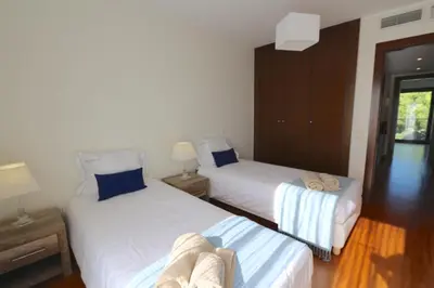 two beds in a room with two lamps at Villa Dolce Vita CD 81 - Clever Details in Vilamoura