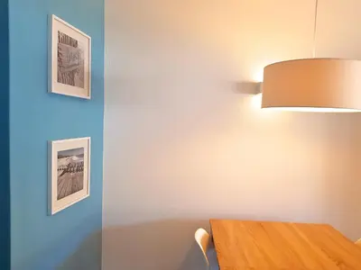 a dining room with a table and a lamp at Ténis Golf Mar CD 14 - Clever Details in Vilamoura