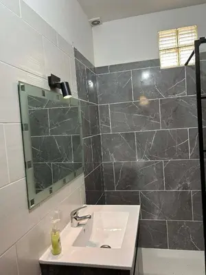a hotel room with a bed and a mirror at CASA JUDITE in Faro