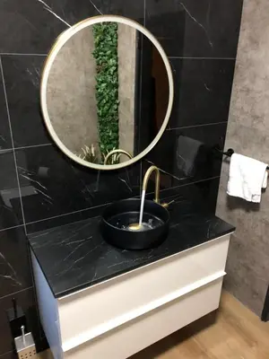a bathroom with a sink and a mirror at Modern Top Floor Apartment 60m2 - Balcony with Pool & Sea View - Vilamoura in Vilamoura