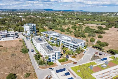 an aerial view of a large white building at Cavalo Preto Luxury Beach Apartment by Golden Zenith in Quarteira