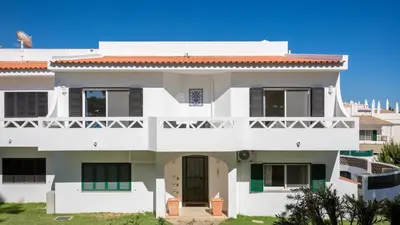 a white house with a red roof at Sienna in Vale do Lobo