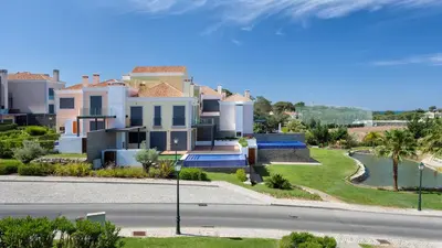 a villa with a view of a road and houses at Emily in Vale do Lobo