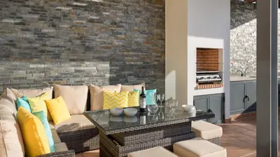 a living room with a couch and a table at Emily in Vale do Lobo