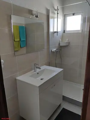 a bathroom with a sink and a mirror and a tub at Alsol C 5365-1 in Quarteira