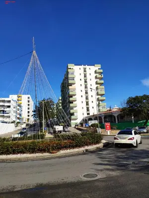a car parked in a parking lot next to some buildings at Alsol C 5365-1 in Quarteira