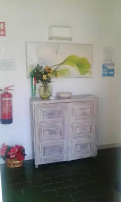 a white dresser with flowers on top of it at Luxurious villa in Albufeira with pool in Albufeira