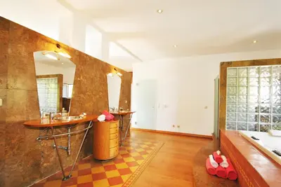 a bathroom with three sinks and a bath tub at Villa Bogota by Algarve Vacation in Albufeira