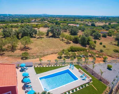 an overhead view of a swimming pool in a resort at Villa Zanzibar by Algarve Vacation in Olhos de Água