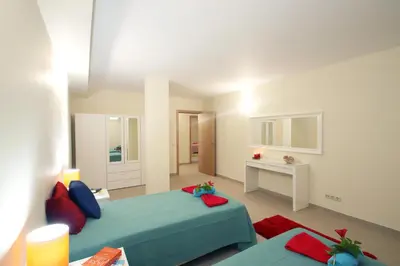a bedroom with a blue bed and a desk at Villa Pauline by Algarve Vacation in Albufeira
