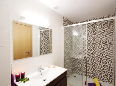 a bathroom with a sink and a shower at Villa Pauline by Algarve Vacation in Albufeira