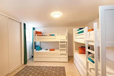 a small room with bunk beds in it at Villa Morais by Algarve Vacation in Guia