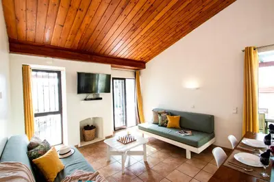 a living room with a couch and a table at Villa Krabi by Algarve Vacation in Albufeira