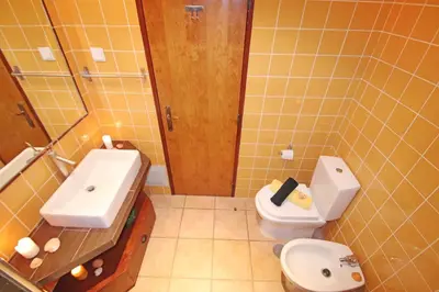 a bathroom with a toilet and a sink at Villa Krabi by Algarve Vacation in Albufeira