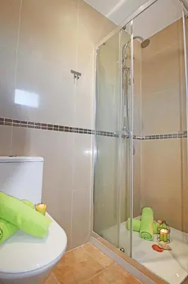 a shower stall in a bathroom with a toilet at Villa Krabi by Algarve Vacation in Albufeira