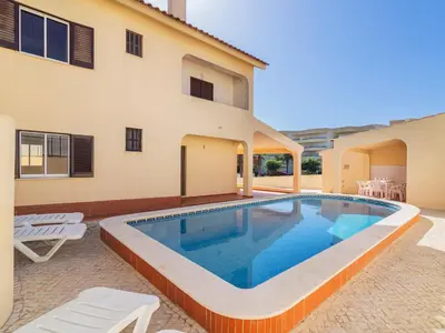 a swimming pool in the backyard of a house at Villa Flor de Maio by Interhome in Patroves