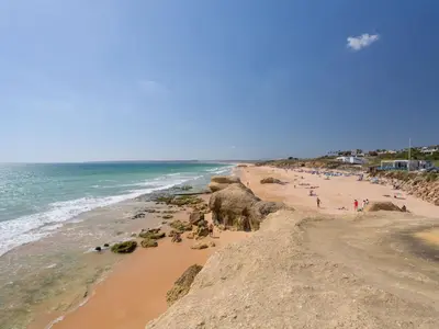 a beach with a group of people and elephants on it at Villa Flor de Maio by Interhome in Patroves