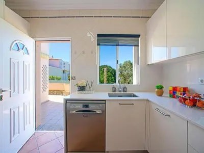 a dining room with a table and chairs at Holiday Home Casa do Sol by Interhome in Patroves