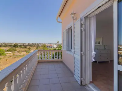 a villa with a swimming pool and lounge chairs at Holiday Home Casa do Sol by Interhome in Patroves
