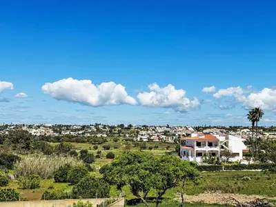 a swimming pool with chairs and a house at Holiday Home Casa do Sol by Interhome in Patroves