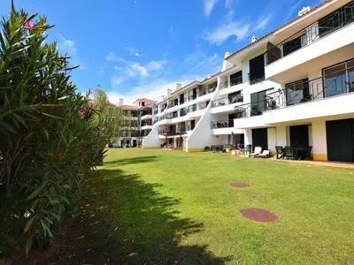 a large yard in front of a building at Sunny Balcony Apartment and Pool in Vilamoura