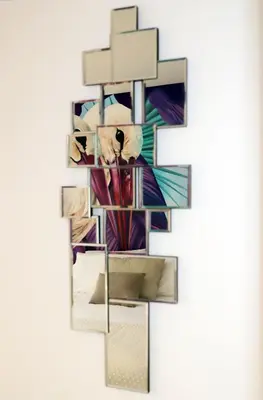 a cross made out of mirrors on a wall at Le Jardin Secret de Faro Guesthouse in Faro