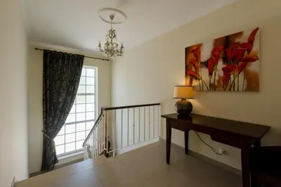 a room with a desk and a painting on the wall at Casa Lago in Quinta do Lago