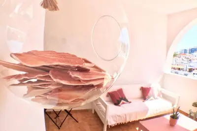 a large glass bowl in a living room with a couch at OLDTOWN great Terrasse & ROOFTOP in Albufeira