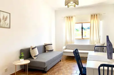 a living room with a couch and a table at OLDTOWN great Terrasse & ROOFTOP in Albufeira