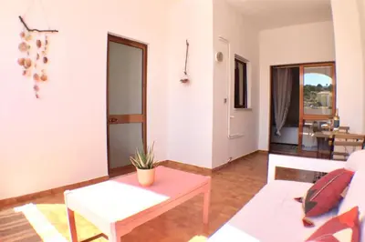 a living room with a white couch and a table at OLDTOWN great Terrasse & ROOFTOP in Albufeira