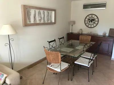 a dining room with a glass table and chairs at Algarve Albufeira, quiet apart with pool at 10 mn walk from Praia da Falesia in Olhos de Água