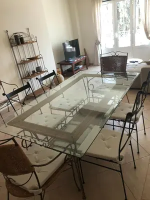 a glass table and chairs in a living room at Algarve Albufeira, quiet apart with pool at 10 mn walk from Praia da Falesia in Olhos de Água