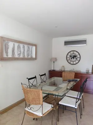 a dining room with a glass table and chairs at Algarve Albufeira, quiet apart with pool at 10 mn walk from Praia da Falesia in Olhos de Água