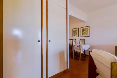 a room with a glass door with a table in it at Village Atlântico Apartment in Vilamoura