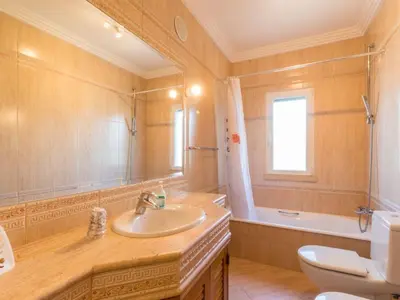 a bathroom with a sink and a toilet at Casa Campo Spacious Living Private Pool Tranquil Setting in Guia