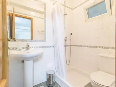 a bathroom with a sink and a toilet and a shower at Casa Campo Spacious Living Private Pool Tranquil Setting in Guia