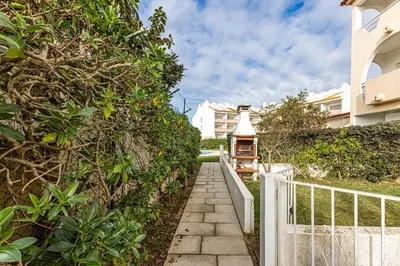 a walkway leading up to a building with a fence at Edif. Valemangude in Albufeira